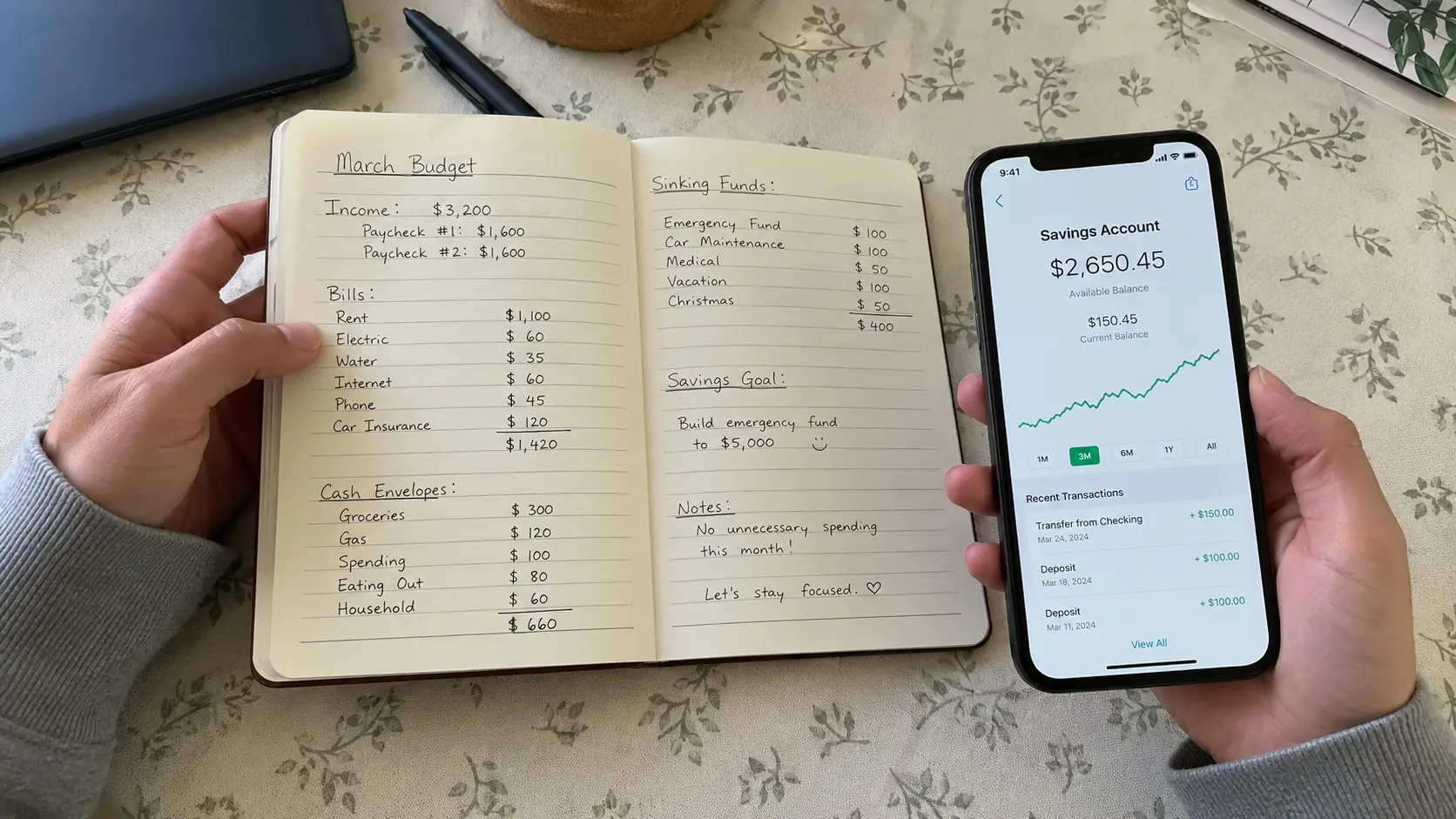 frugal living tips in action with hands reviewing a monthly budget notebook next to a phone showing savings account balance
