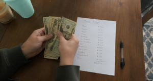 Extreme Frugal Living: What Actually Works vs What Makes You Miserable Extreme Frugal Living: hands counting cash on a kitchen table next to a handwritten monthly budget with expenses listed