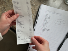 How to Save Money on Groceries: 4 Decisions That Cut Your Bill hands holding a grocery receipt next to an open notebook with weekly food budget written at the top
