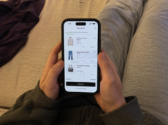 How to Stop Impulse Buying: 7 Fixes That Actually Work hands scrolling through an online shopping app on phone with items in cart visible from above angle